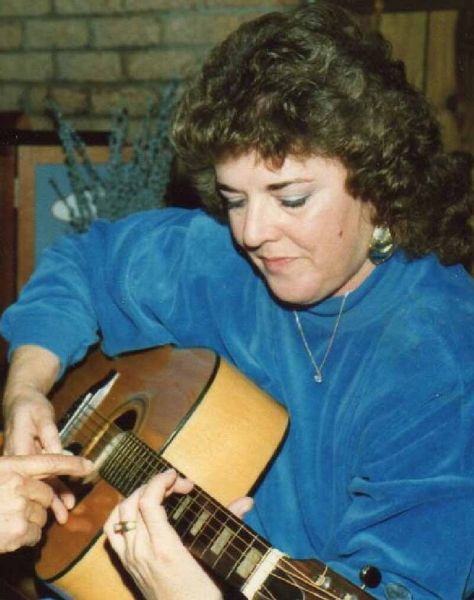 A vintage family photograph with Bobby's Conn guitar